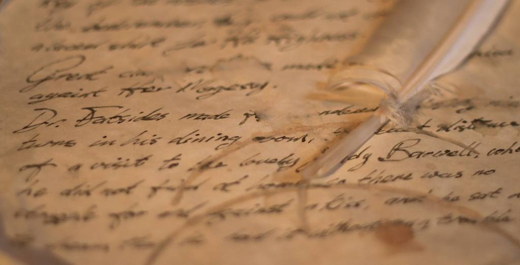 Feather quill and handwritten letter