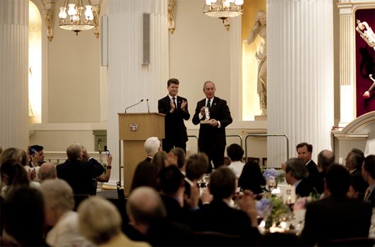 Men speaking at dinner gala