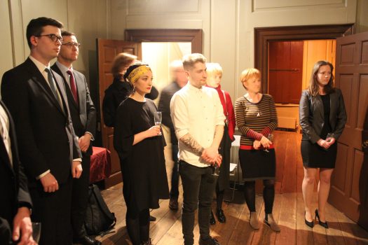 People watching a presentation in Franklin's parlour