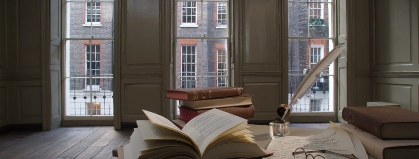 Books and bifocals on a desk in Franklin's parlour