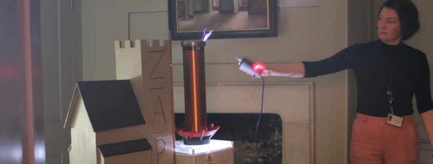 Mini Tesla coil being fired with blue lightning