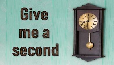 Text 'give me a second' and clock